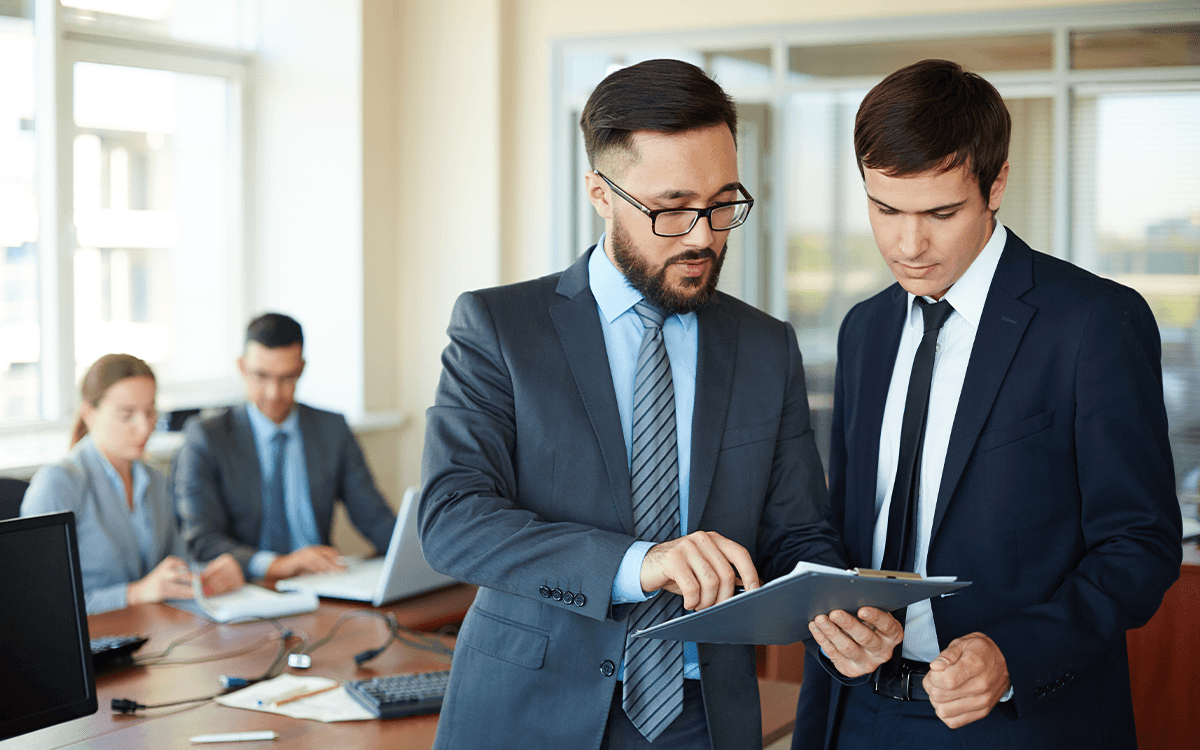 businessman showing changes report 1