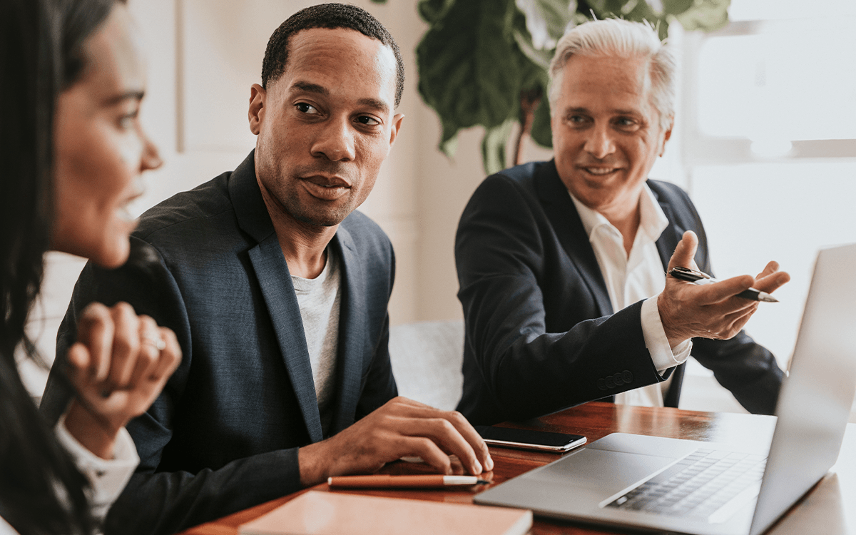 happy business people using laptop 1